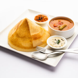 Cone shape dosa, also called dosai, dosey, or dosha, is a thin pancake in South Indian cuisine